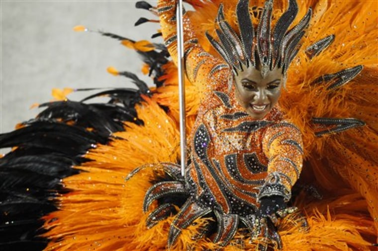 A dancer of Porto da Pedra samba school parades during Carnival celebrations Monday at the Sambadrome in Rio de Janeiro, Brazil.